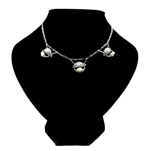 An Art Nouveau silver chain necklace featuring three crab motif drops, each holding an iridescent river pearl. View II
