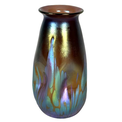 A baluster-shaped Art Nouveau iridescent glass vase featuring fluid metallic blue and gold drip trailing across a bronze-toned body. View IV