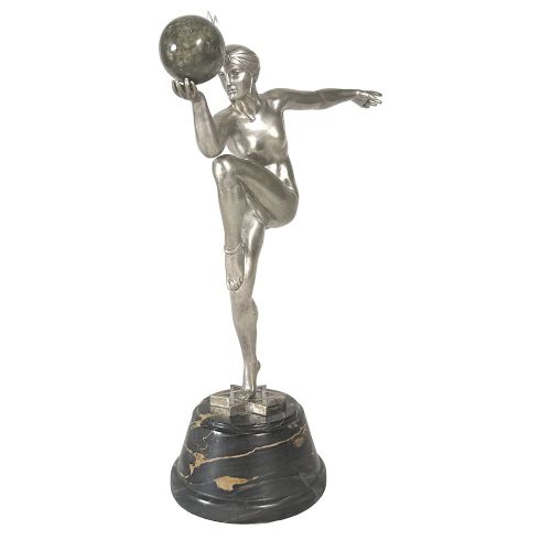An Art Deco silvered bronze sculpture depicting a stylized female dancer balancing a sphere on her hand, mounted on a dark marble base. View II