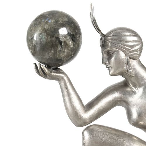 An Art Deco silvered bronze sculpture depicting a stylized female dancer balancing a sphere on her hand, mounted on a dark marble base. View III