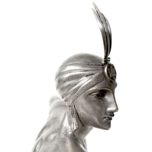 An Art Deco silvered bronze sculpture depicting a stylized female dancer balancing a sphere on her hand, mounted on a dark marble base. View VI