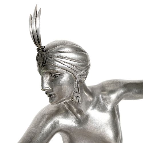 An Art Deco silvered bronze sculpture depicting a stylized female dancer balancing a sphere on her hand, mounted on a dark marble base. View VII