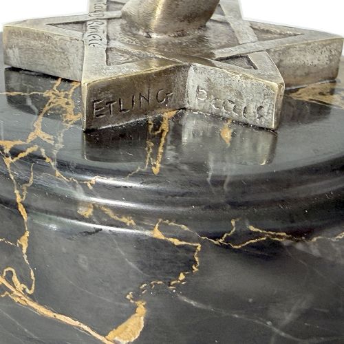 An Art Deco silvered bronze sculpture depicting a stylized female dancer balancing a sphere on her hand, mounted on a dark marble base. View VIII