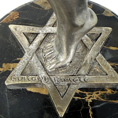An Art Deco silvered bronze sculpture depicting a stylized female dancer balancing a sphere on her hand, mounted on a dark marble base. View IX