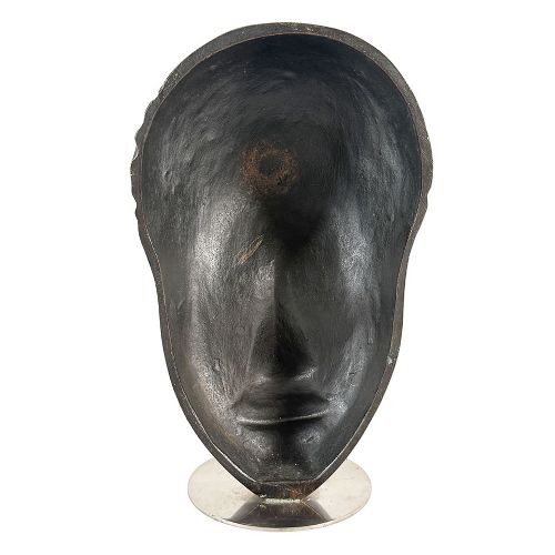 A dark patinated bronze Art Deco bust depicting a stylized female head with textured hair on a circular metal base. View VI