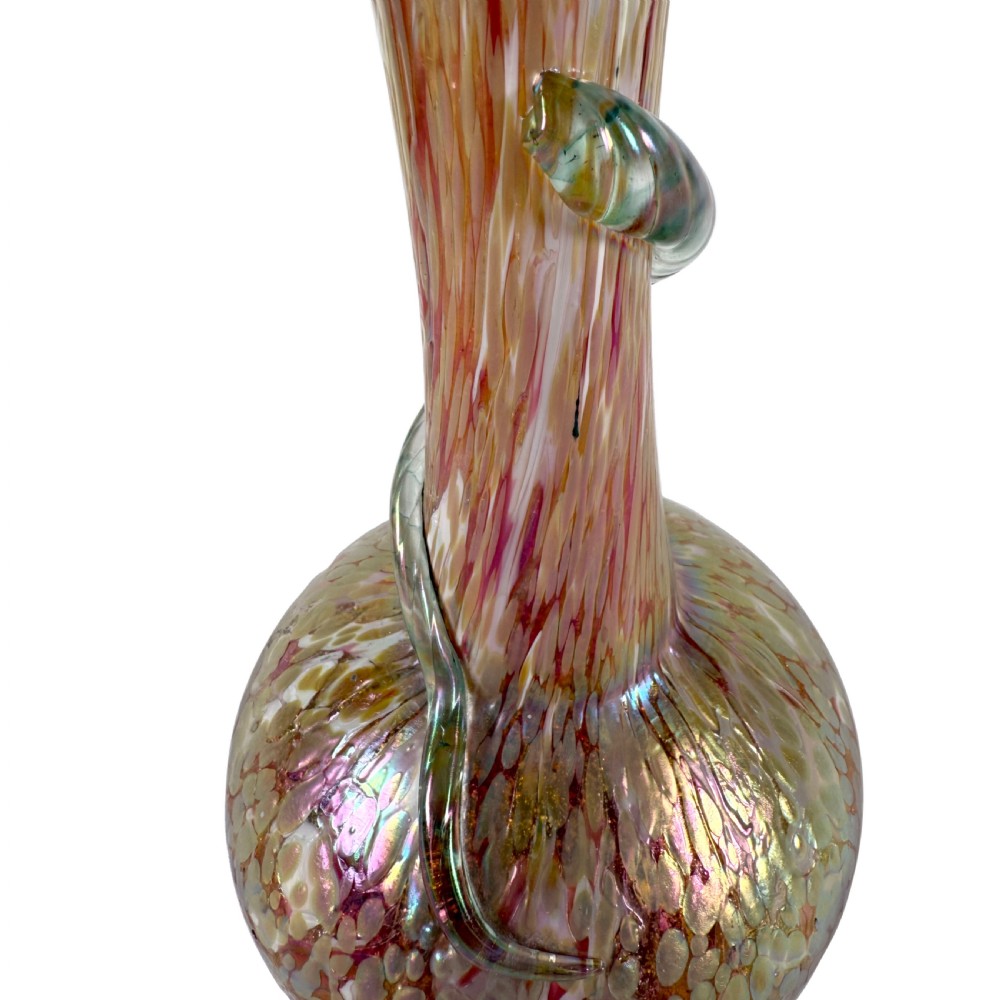 An Art Nouveau blown glass vase with a flared neck, bulbous base, iridescent mottled pink and gold finish, and an applied glass snake coiled around the neck. View VI