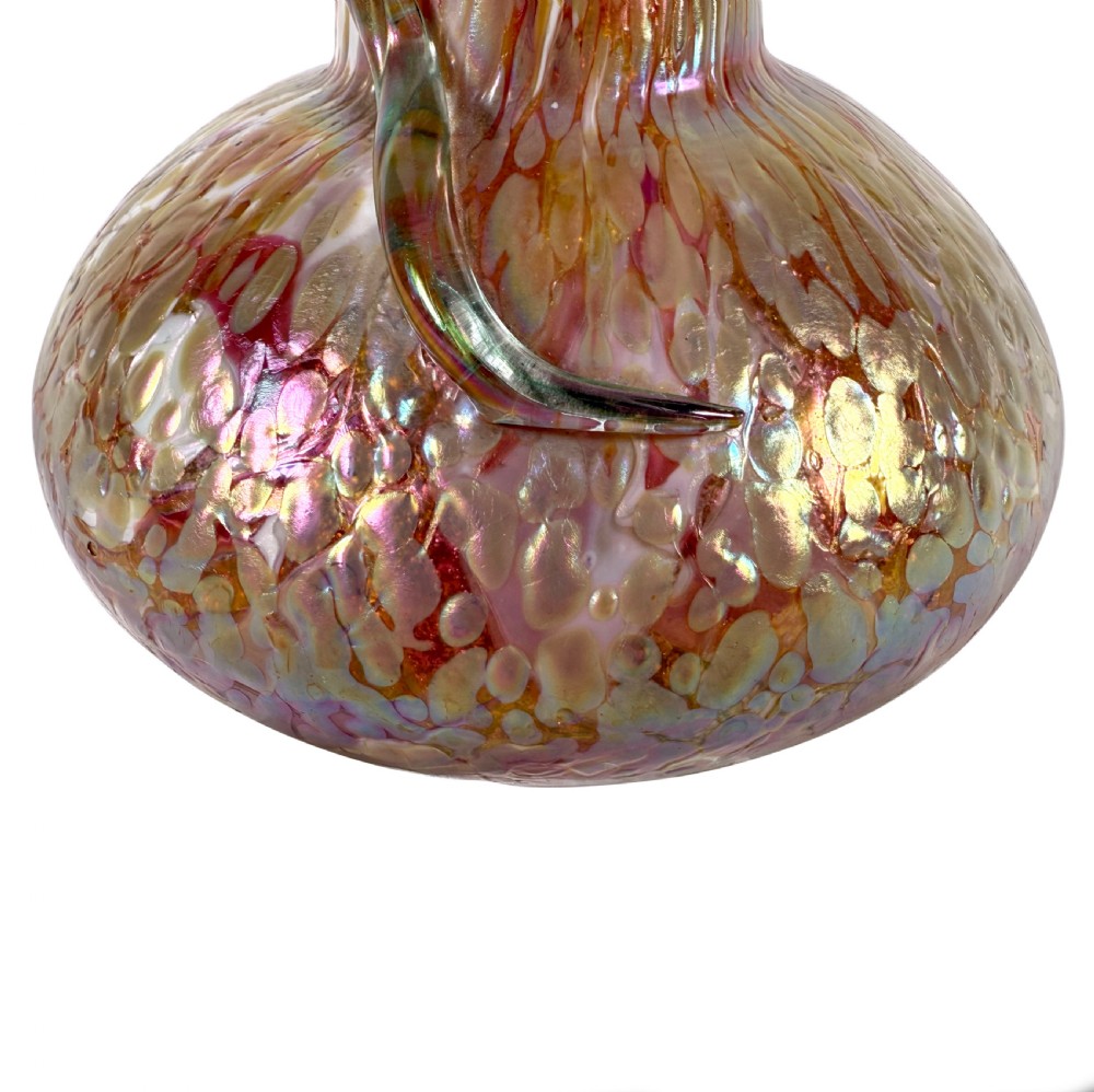 An Art Nouveau blown glass vase with a flared neck, bulbous base, iridescent mottled pink and gold finish, and an applied glass snake coiled around the neck. View VII