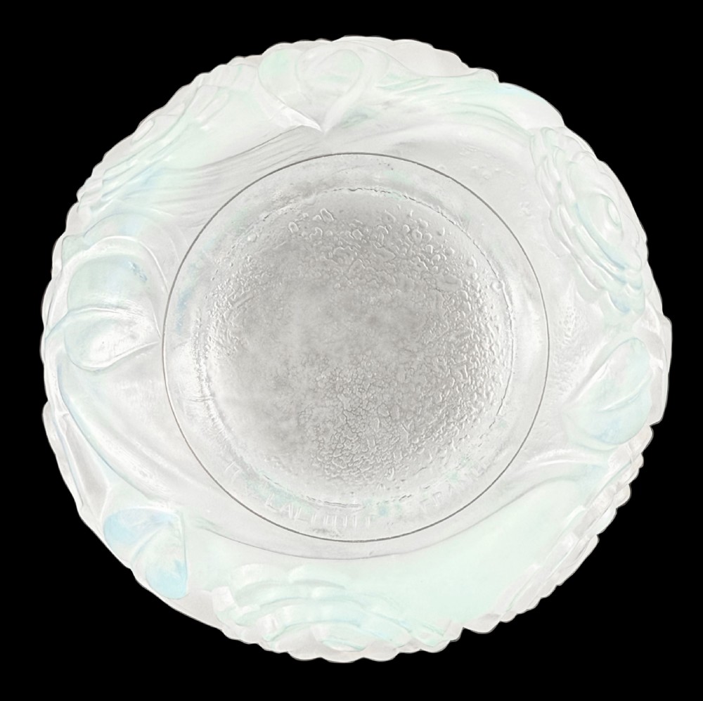 An Art Deco opalescent glass vase with a smooth flared upper rim and a rounded lower body decorated with moulded buttercup relief patterns. View VI