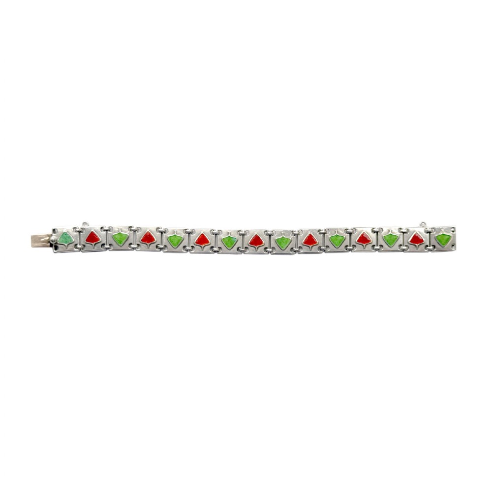 A German Jugendstil silver panel bracelet featuring linked rectangular segments inset with red and green enamelled geometric motifs. View II