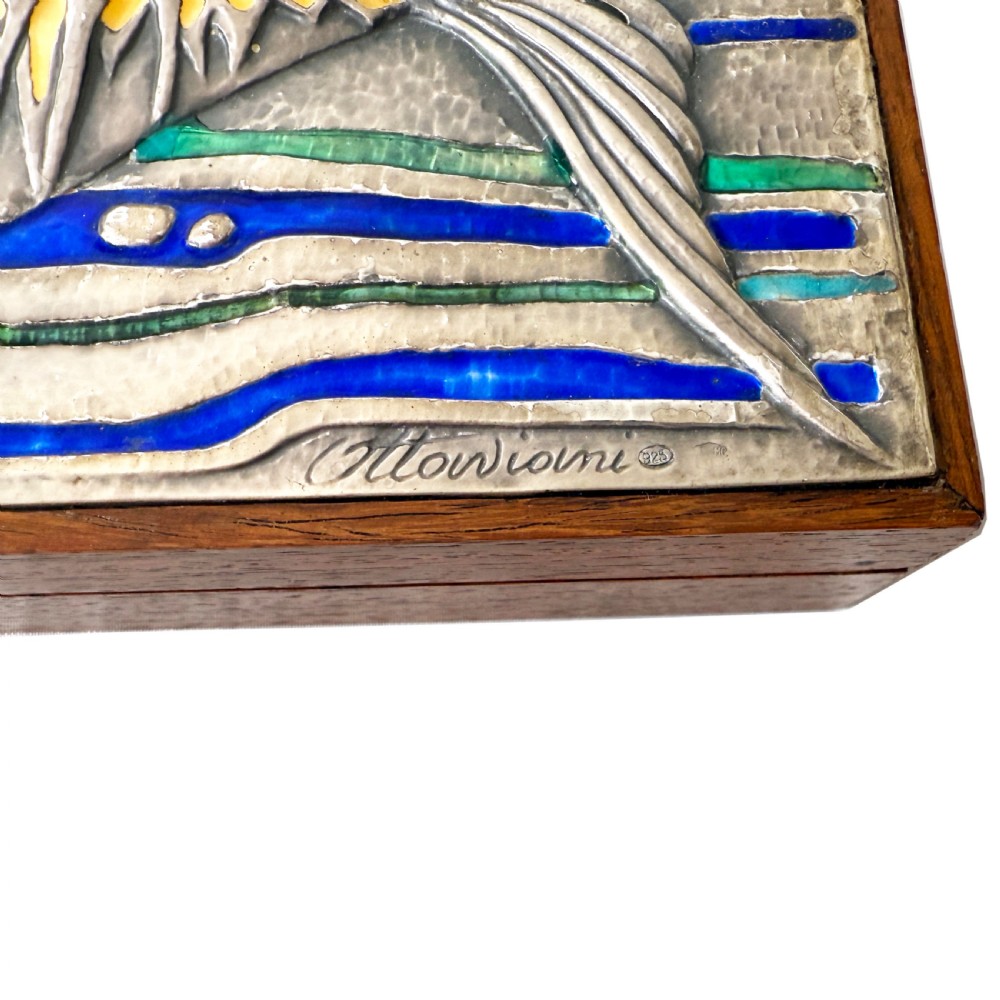 A rectangular mid-century rosewood box featuring a textured silver lid decorated with a stylised fish motif in blue, green, yellow, and red enamel. View IV