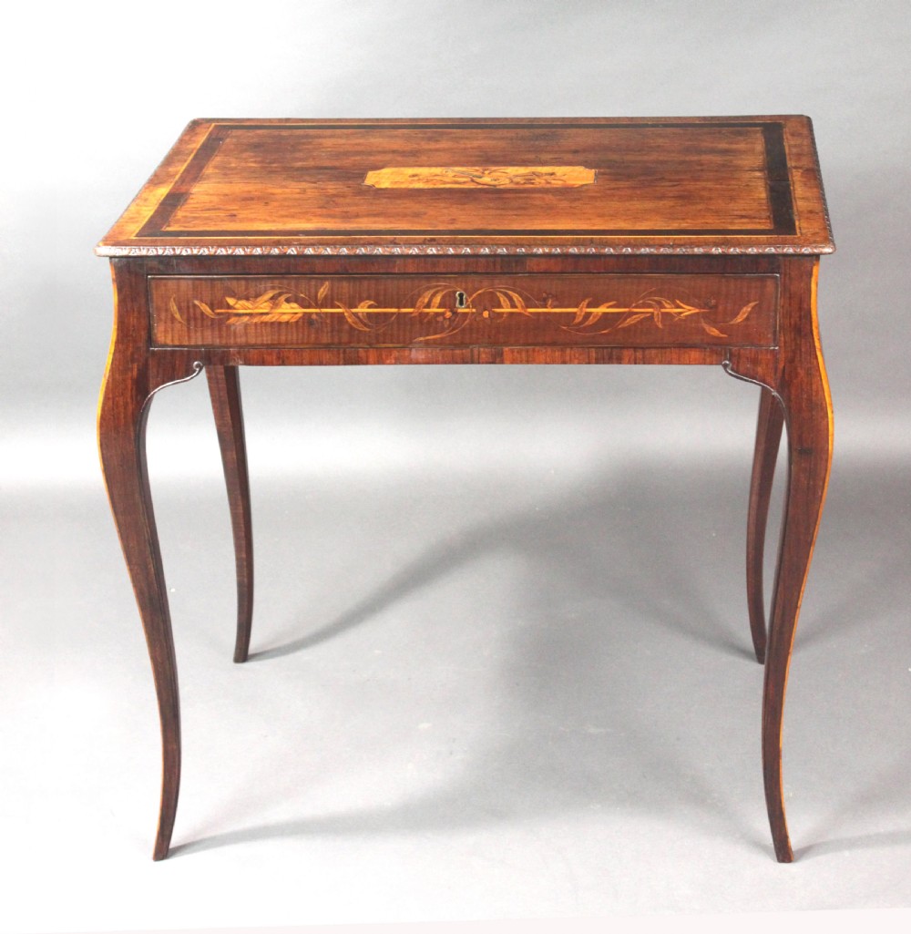 A rectangular George III style mahogany centre table featuring intricate floral marquetry inlay on the top and frieze, supported by slender cabriole legs. View II