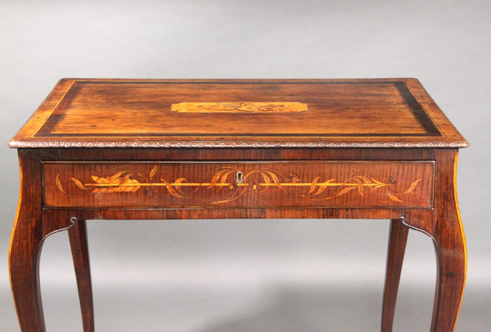 A rectangular George III style mahogany centre table featuring intricate floral marquetry inlay on the top and frieze, supported by slender cabriole legs. View III