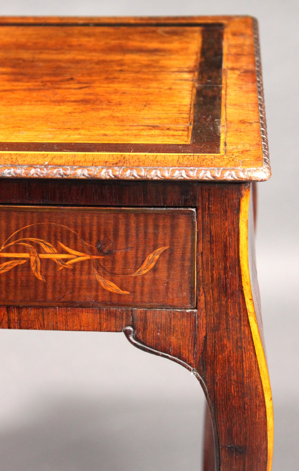 A rectangular George III style mahogany centre table featuring intricate floral marquetry inlay on the top and frieze, supported by slender cabriole legs. View IV