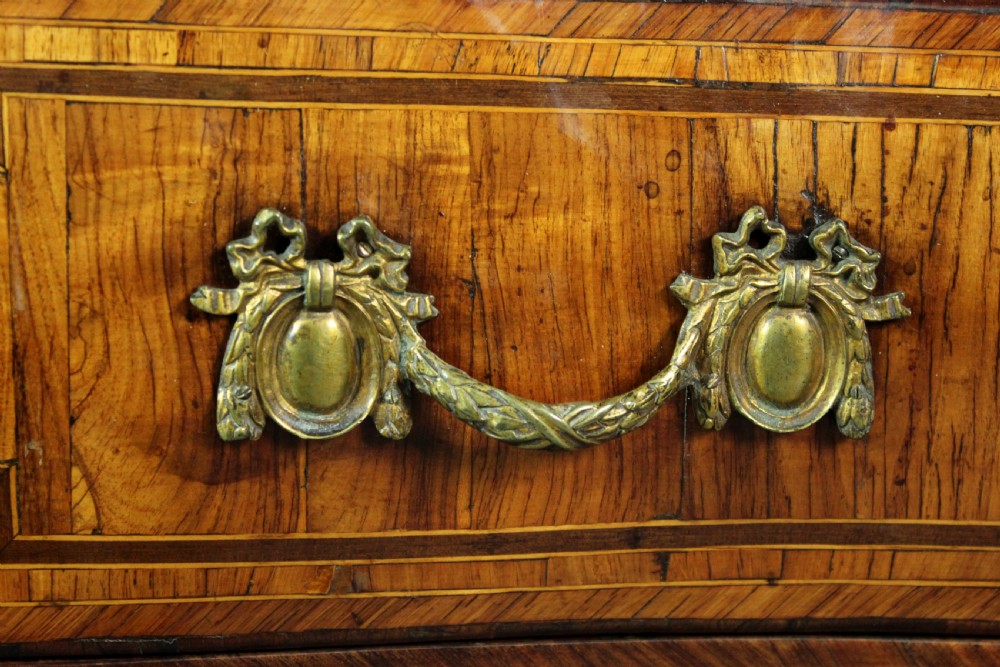 A Louis XV style kingwood commode featuring three drawers with geometric parquetry inlay, gilt bronze mounts, and a shaped grey marble top. View VI