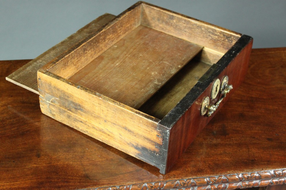 An antique Chippendale mahogany fold-over card table with cabriole legs, carved ball and claw feet, and a single drawer with brass hardware. View VIII