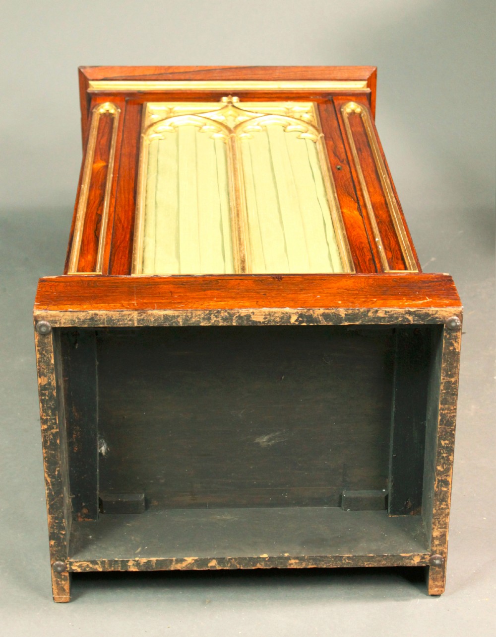 A pair of dark rosewood Regency Gothic pedestal cupboards featuring white marble tops with pierced brass galleries and pleated green silk doors framed by gilt tracery. View VIII