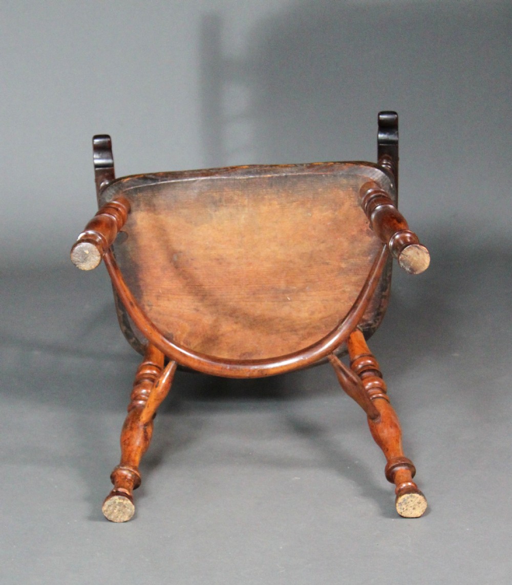 An antique high-back yew wood Windsor armchair featuring a pierced decorative splat, spindle backrest, turned legs, and a curved crinoline stretcher. View VI