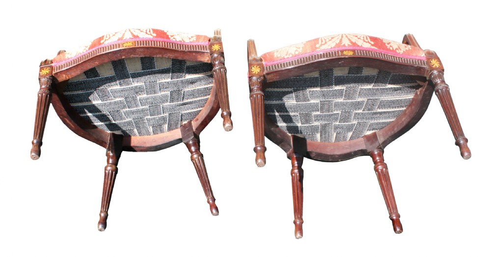 A pair of antique George III mahogany armchairs featuring oval backs and patterned red and gold damask upholstery. View VII