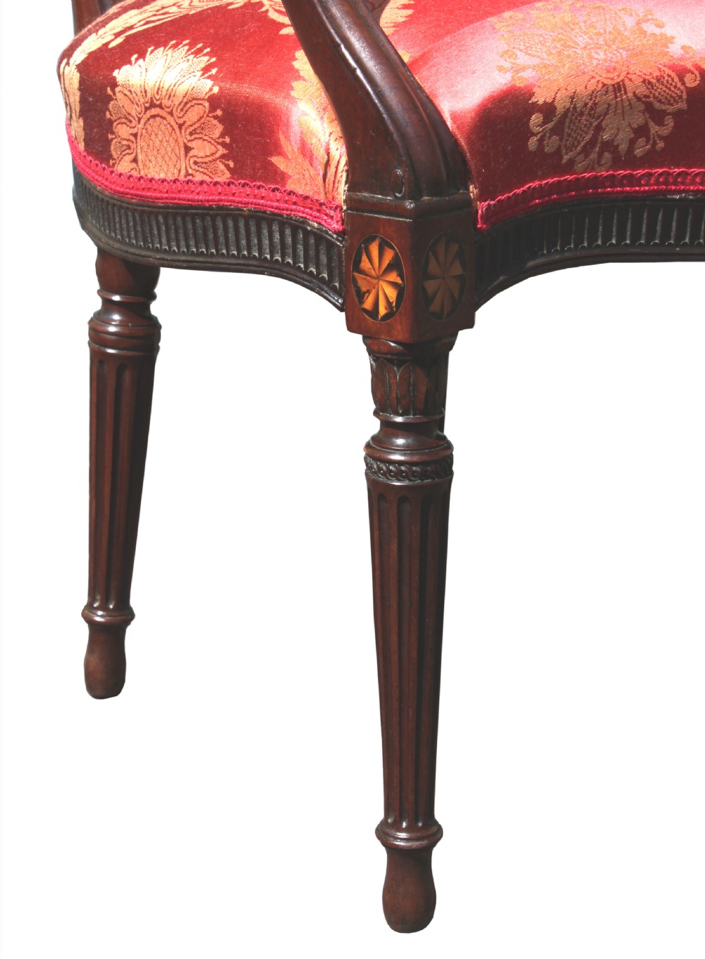 A pair of antique George III mahogany armchairs featuring oval backs and patterned red and gold damask upholstery. View IX