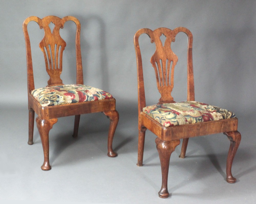 A pair of 18th-century George II walnut side chairs featuring pierced vase-shaped splats, floral upholstered drop-in seats, and front cabriole legs. View III