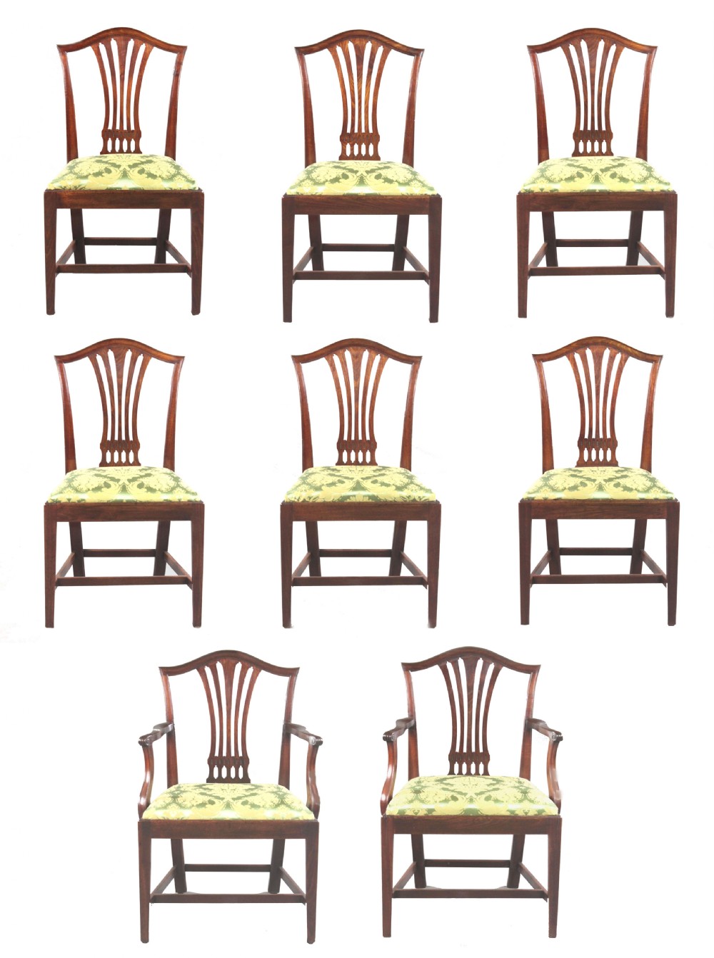 A set of eight Georgian mahogany dining chairs featuring carved pierced back splats and green damask upholstered seats, including six side chairs and two armchairs. View II