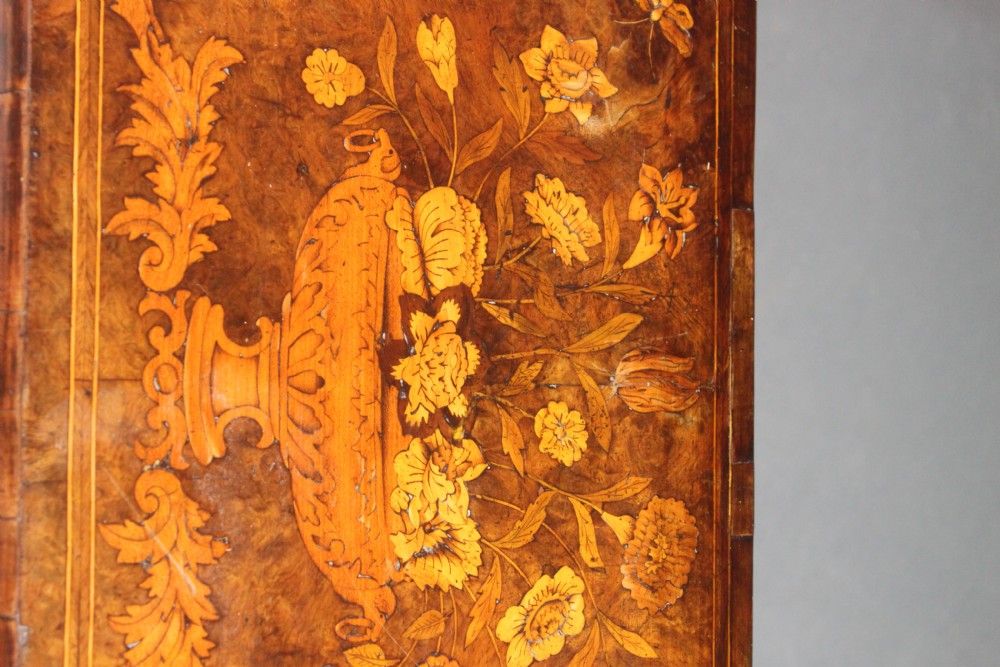 An antique Dutch walnut card table featuring detailed floral marquetry inlay, a serpentine frieze with a single drawer, and slender legs. View V