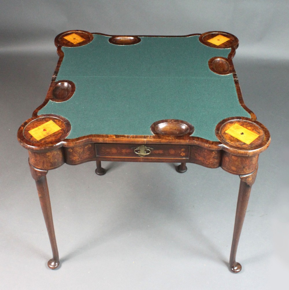 An antique Dutch walnut card table featuring detailed floral marquetry inlay, a serpentine frieze with a single drawer, and slender legs. View VI