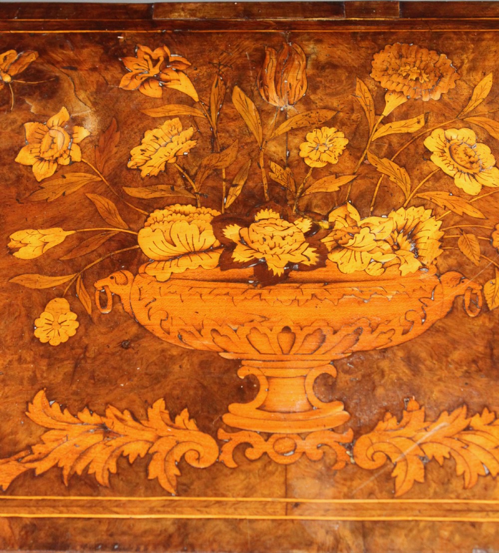 An antique Dutch walnut card table featuring detailed floral marquetry inlay, a serpentine frieze with a single drawer, and slender legs. View X