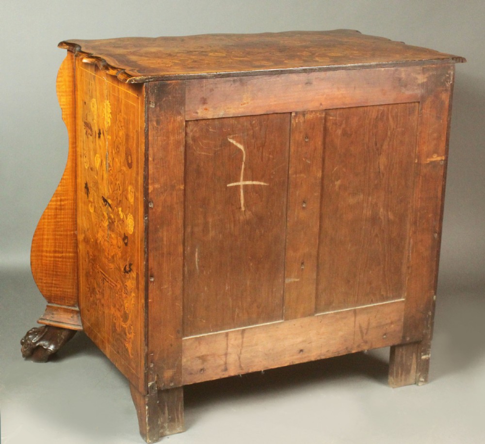 An antique Dutch walnut bombe chest featuring detailed floral marquetry inlays, four drawers, cast brass handles, and carved claw and ball feet. View XIV