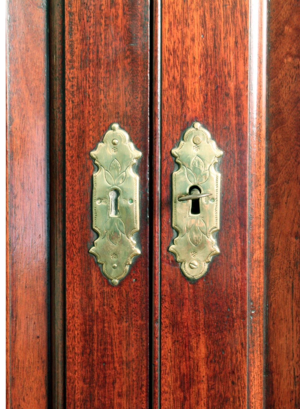 A Georgian mahogany bureau bookcase featuring a swan-neck pediment top, twin panelled upper doors, a slant-front writing bureau with fitted pigeonholes, and three base drawers on bracket feet. View VII