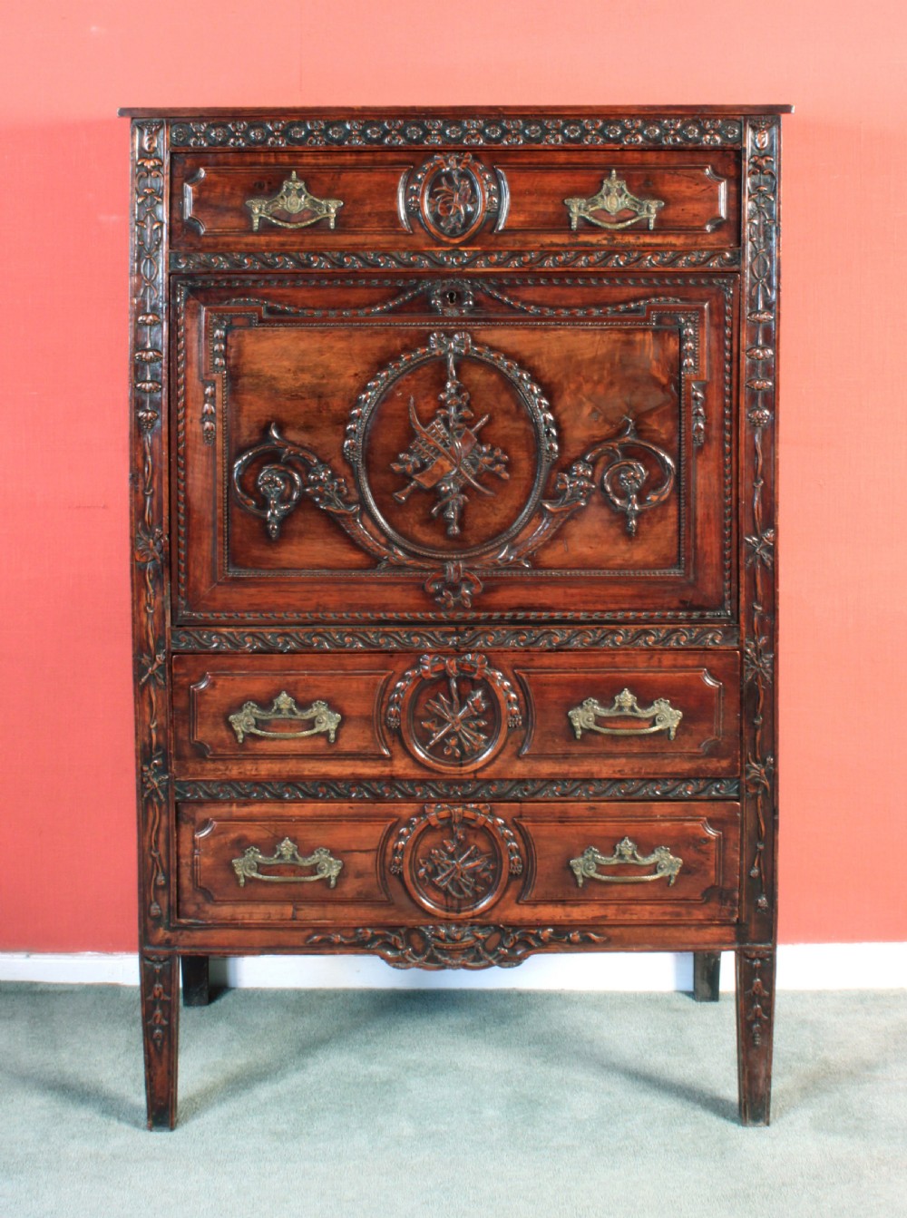 An antique Louis XVI carved walnut escritoire cabinet with an open fall-front flap showing a green writing surface and internal storage drawers. View III