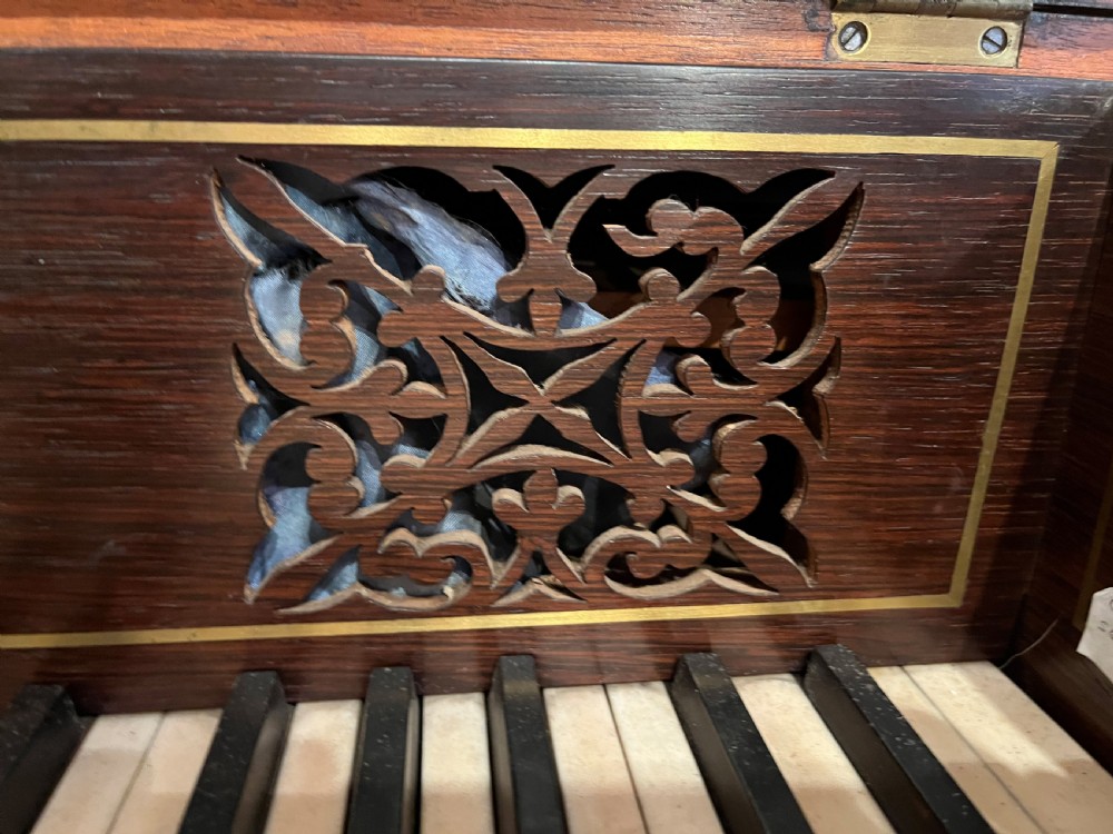 A Regency mahogany square piano crafted by Wood, Small and Co, raised on turned reeded legs with brass castors and featuring an open music rest. View VII