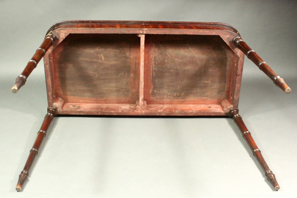 A matching pair of Georgian mahogany serving tables featuring flame veneer aprons and turned tapered legs. View VI