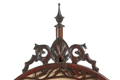 fig 1. A Victorian carved mahogany tripod pole screen featuring an oval frame with a floral needlepoint tapestry, set atop a turned pole with carved scroll feet and a top finial.