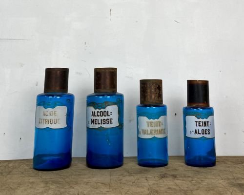 four blue apothecary bottles - CATEGORY: ANTIQUE GLASS - DATED 19TH CENTURY