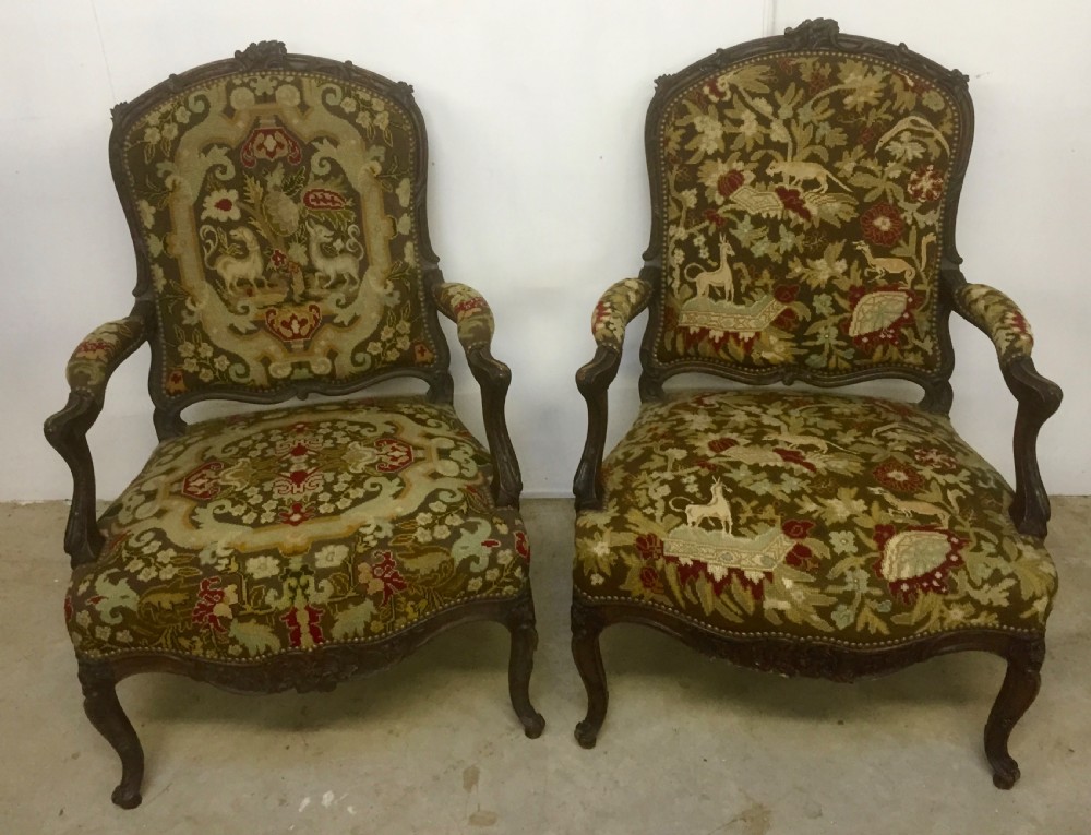 pair of walnut and tapestry armchairs