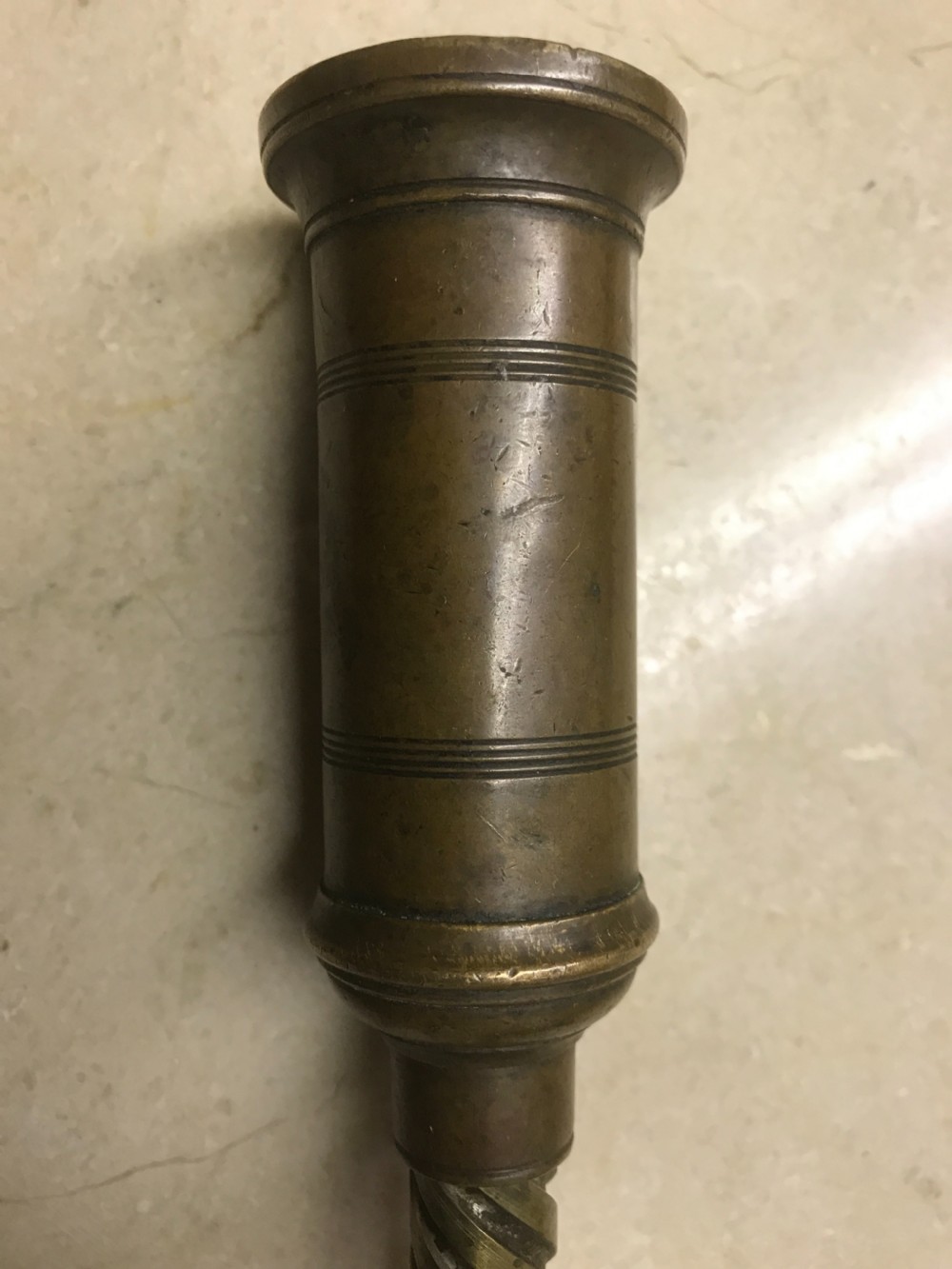 An antique Victorian mechanical brass corkscrew with a ribbed turned bone handle, an integrated dusting brush, and a steel helix worm at the base. View IV