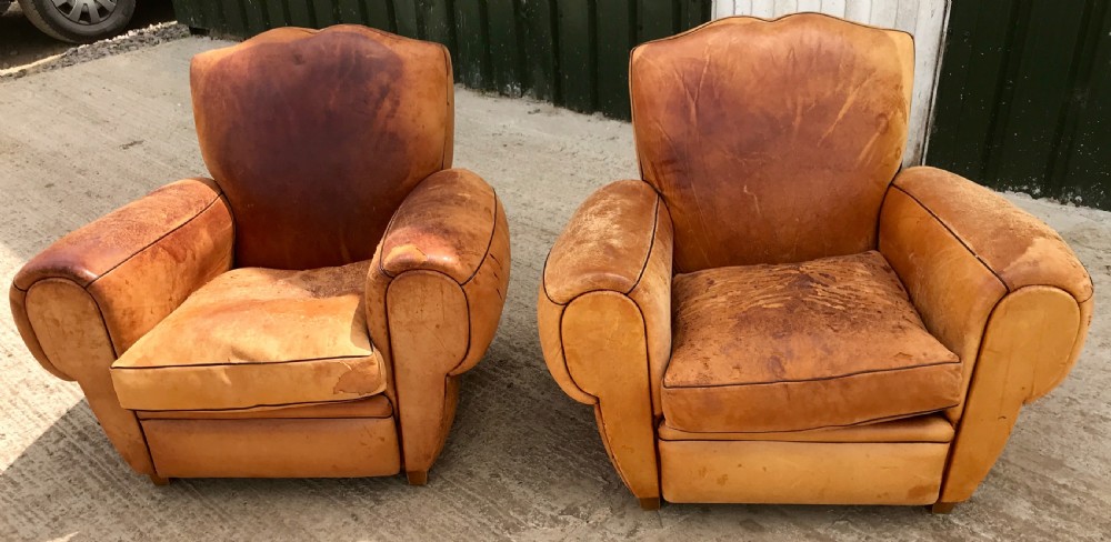 Pair of leather moustache club armchairs
