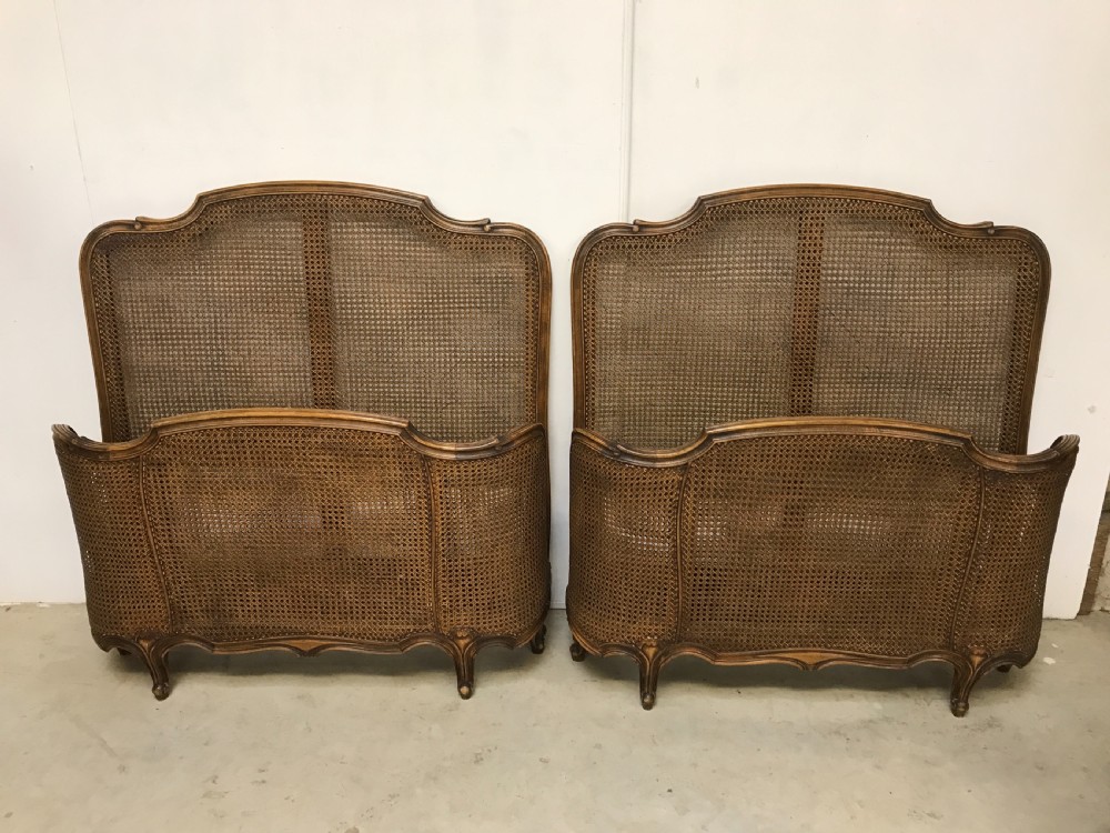 A Pair of French cane beds 