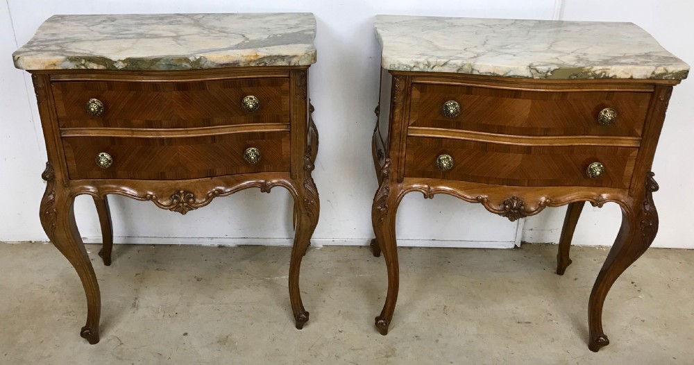 Pair of walnut and marble lamp tables 