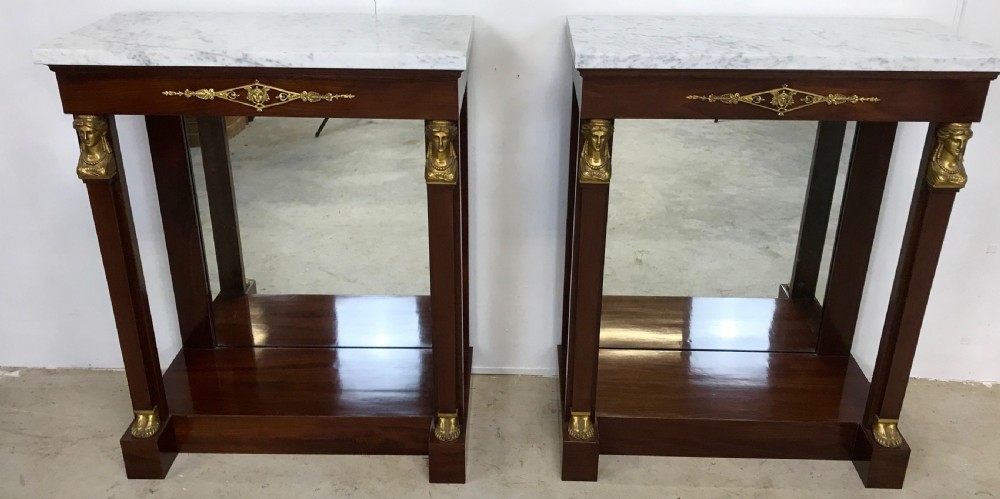 A Pair of empire console tables