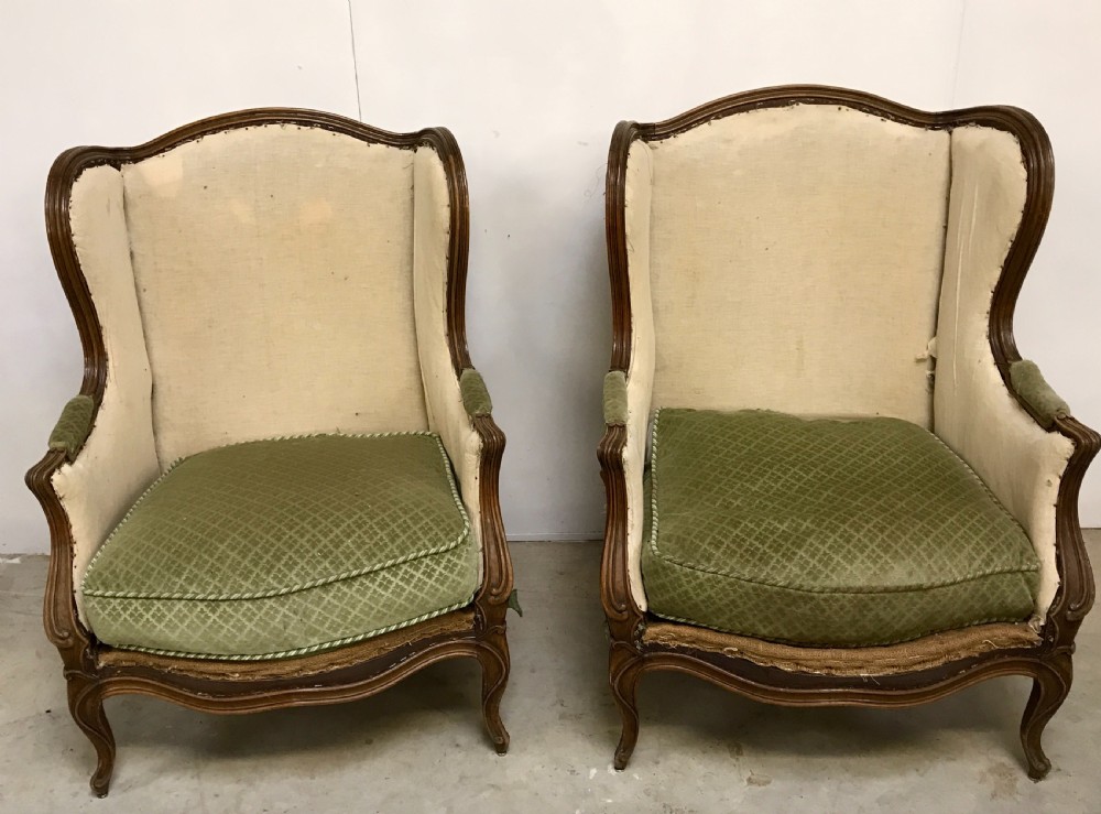 Pair of Walnut Wing Back Armchairs