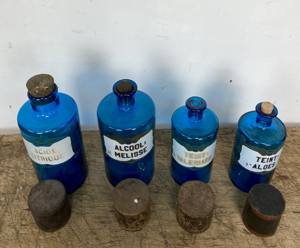 Four Blue Apothecary Bottles View IX