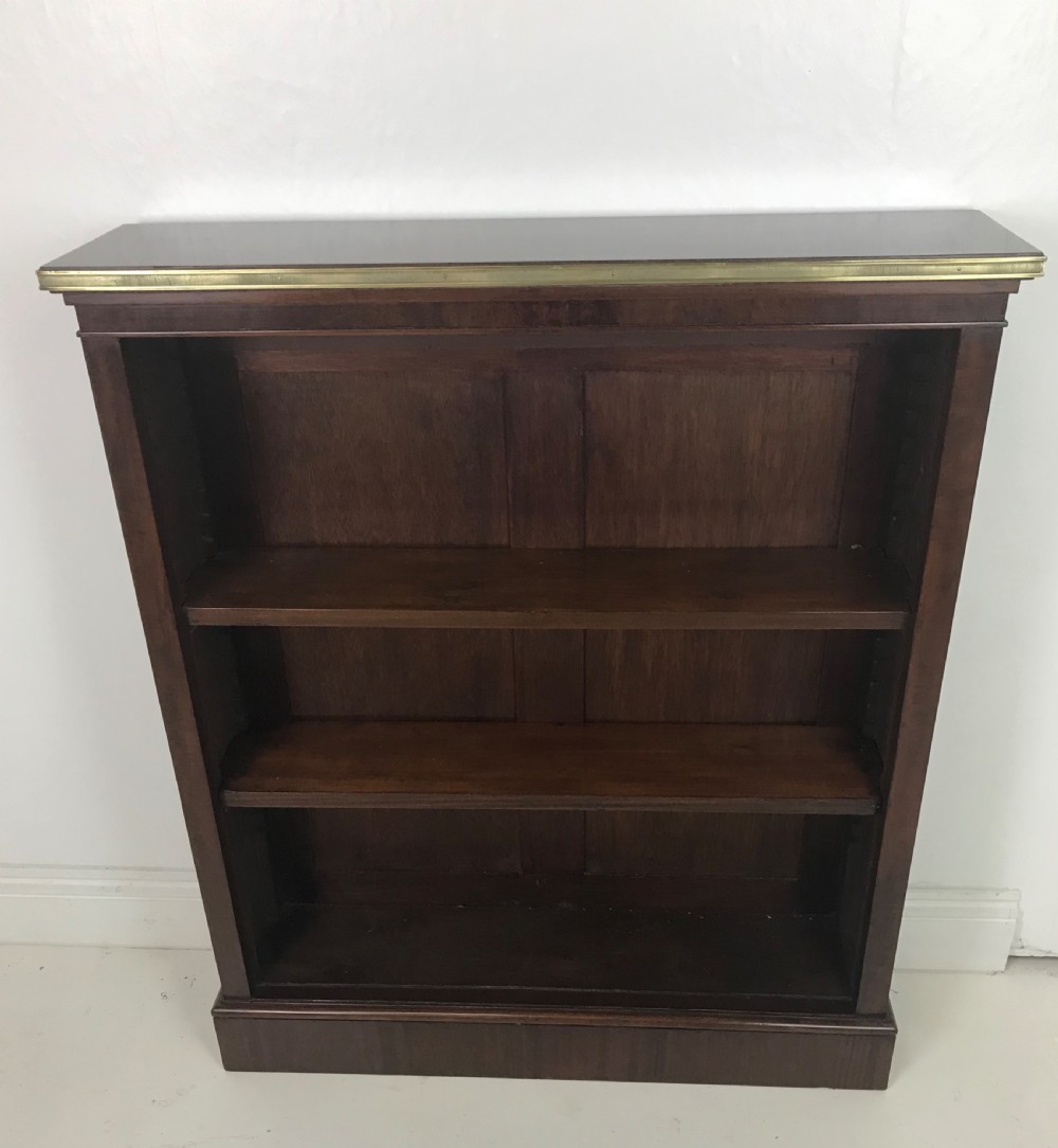 A Mahogany and brass open bookcase 