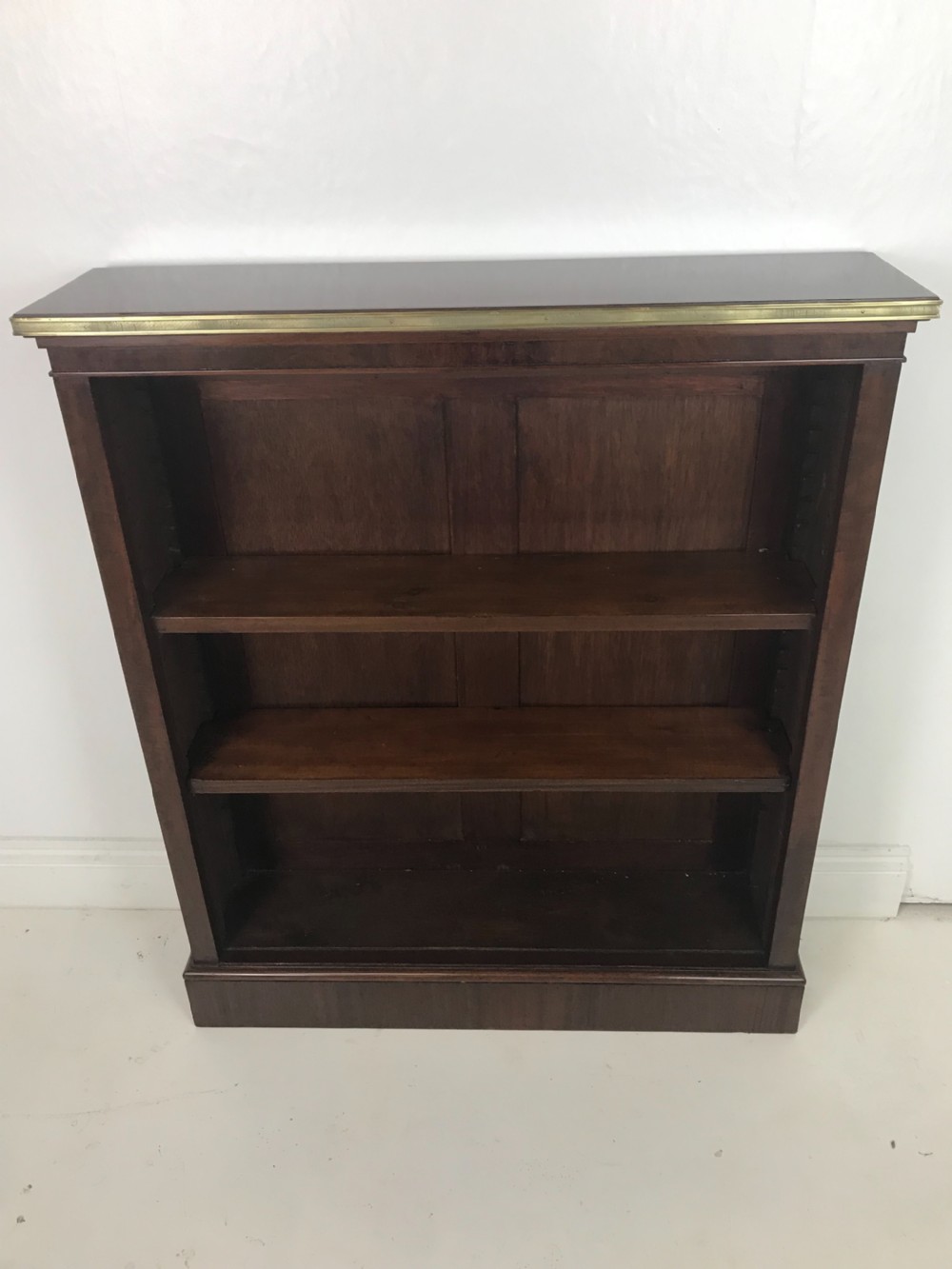 A Mahogany and brass open bookcase  View II