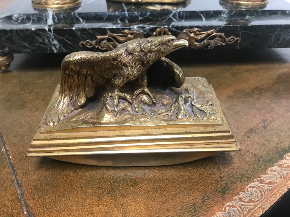 A French gilt bronze eagle sculpture mounted on a black marble base with two lidded ink pots, a pen recess, and an accompanying rocker blotter. View II