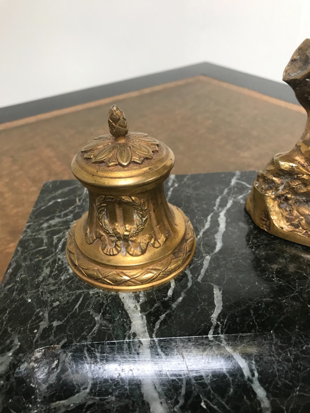 A French gilt bronze eagle sculpture mounted on a black marble base with two lidded ink pots, a pen recess, and an accompanying rocker blotter. View V