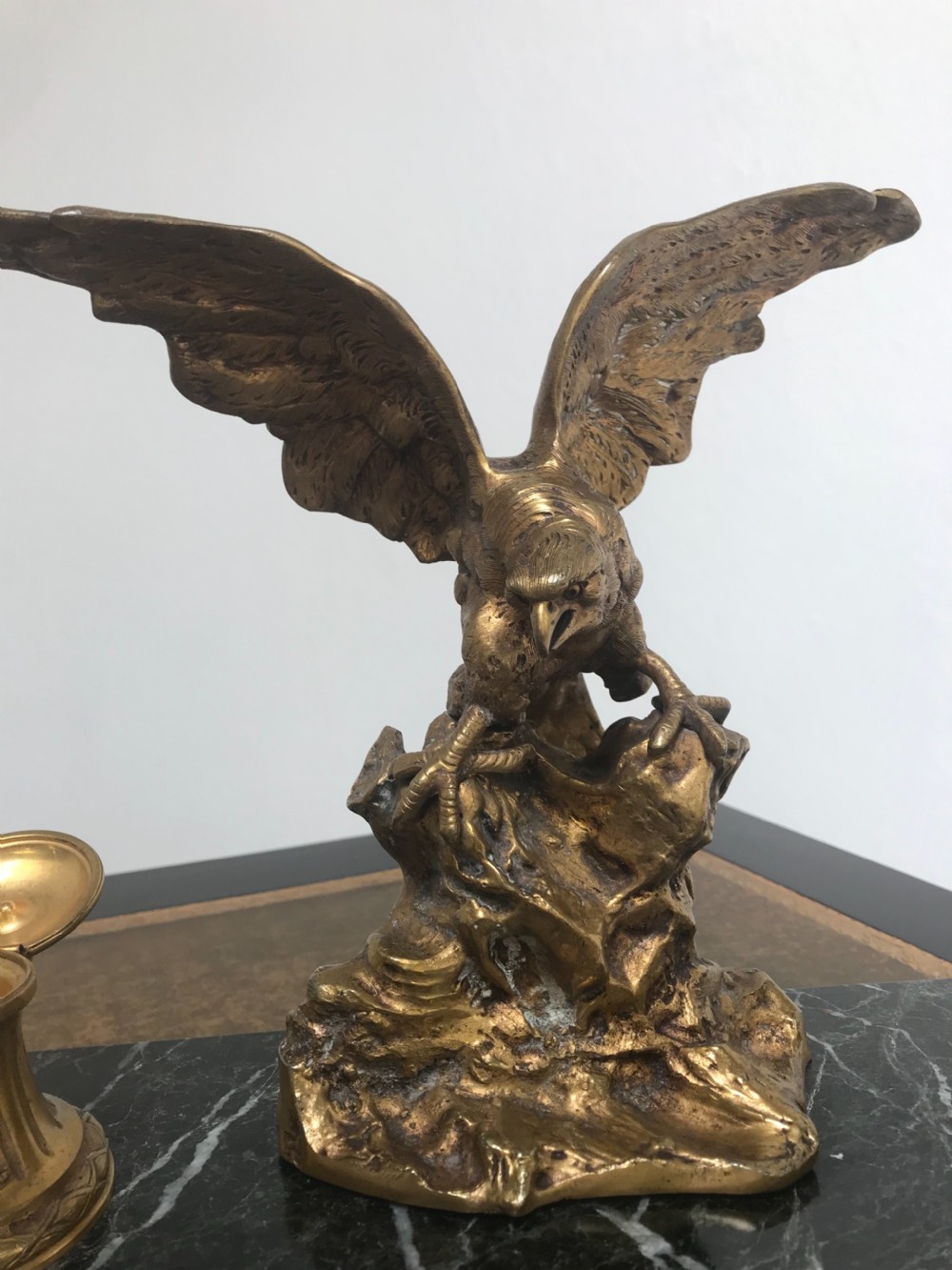 A French gilt bronze eagle sculpture mounted on a black marble base with two lidded ink pots, a pen recess, and an accompanying rocker blotter. View IX