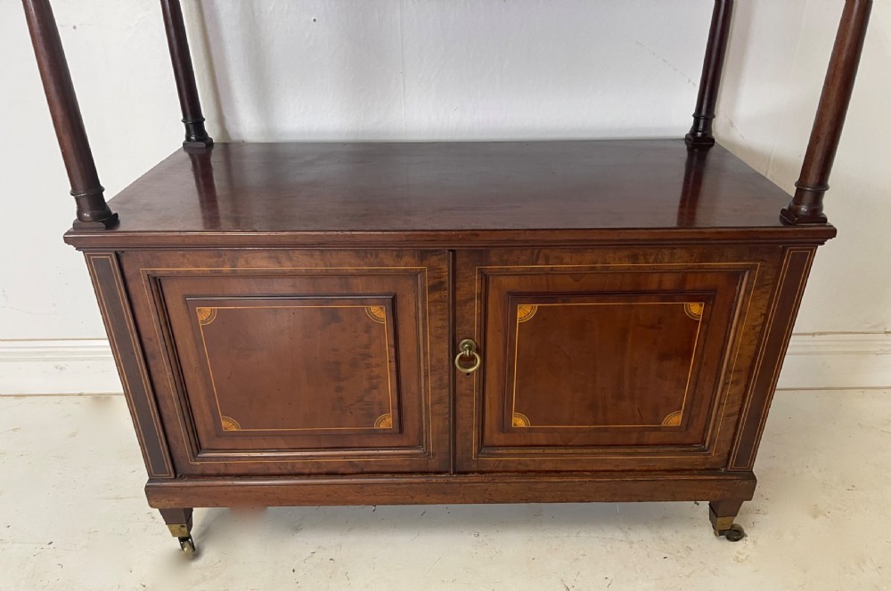 An inlaid mahogany sideboard and matching serving table featuring brass gallery rails and satinwood fan marquetry. View V