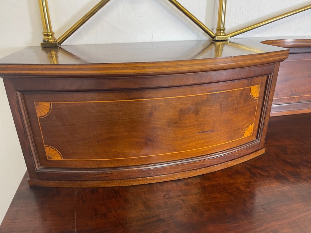 An inlaid mahogany sideboard and matching serving table featuring brass gallery rails and satinwood fan marquetry. View XXIV